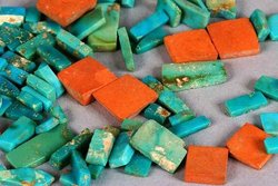 A selection of  (Anasazi) turquoise and orange  inlay pieces from  (dated ca. 1020-1140 CE) show the typical colour range and mottling of American turquoise.