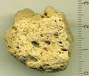 Specimen of highly porous pumice from  volcano on , . Density of specimen approx 0.25 /. Scale is in .