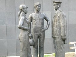 Statue of workers and Stasi official in front of the former Stasi archives building, Mitte district, Berlin (The official has been egged a few times)