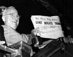 The Chicago Daily Tribune, like most of the press, believed Dewey would comfortably win the election, as shown by this post-election headline, which Harry Truman happily displays in this photo.