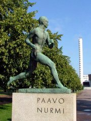 Statue of Paavo Nurmi in front of the  in Helsinki