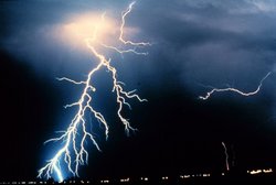 Multiple cloud-to-ground and cloud-to-cloud lightning strokes are observed during a night-time thunderstorm.