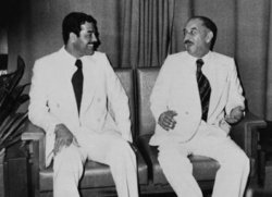 Saddam Hussein talking with 