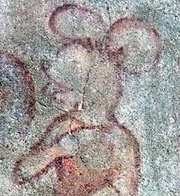 On November 14, 2002, this image was discovered during restoration of a church's outside wall in the town of . It is part of a 14th century fresco depicting  of the , who is often shown accompanied by fabulous creatures: Mickey Mouse bears a striking resemblance to this image