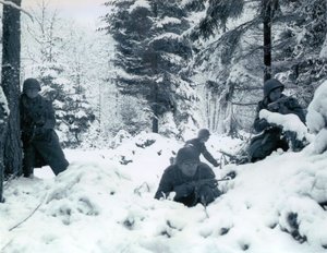 American soldiers taking up defensive positions in the Ardennes during the Battle of the Bulge