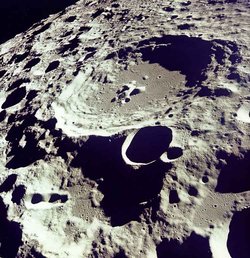 Lunar astronomy: the large crater is , photographed by the crew of  as they circled the  in 1969.  Located near the center of the  of Earth's Moon, its diameter is about 58 miles (93 km).