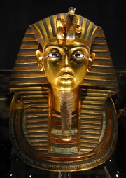 The iconic gold burial mask of , inlaid with turquoise, ,  and coloured .
