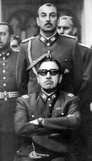 Pinochet (sitting) as Chairman of the Junta following the coup (1973)