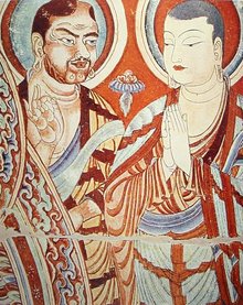 Blue-eyed Central Asian Buddhist monk, possibly Bodhidharma, forming the "Vitarka"  (Symbol of teaching/ discussion of the ), in the direction of an East-Asian monk. Eastern , China, 9th-10th century.
