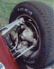 Suspension, showing tie rod, steering arm, king pin (axis) ball joints