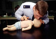 CPR demonstrated on a infant dummy