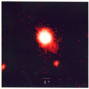 This view, taken with infrared light, is a false-color image of a quasar-starburst tandem with the most luminous starburst ever seen in such a combination. The quasar-starburst was found by a team of researchers from six institutions.