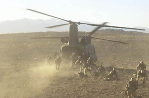 Soldiers board a Chinook in Operation Anaconda