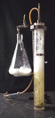 An apparatus feeding into an Erlenmeyer flask