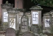 A French Jewish cemetery after being crudely defaced by Neo-Nazis
