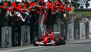 The Scuderia celebrate Schumacher's win at the A1-Ring, 2003 (C) Ferrari Press Office