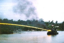 Riverboat of the U.S. brownwater navy deploying napalm during the 