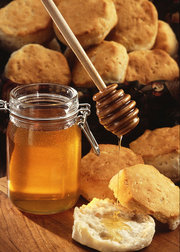 Scones with honey. Jam is also a favoured topping.