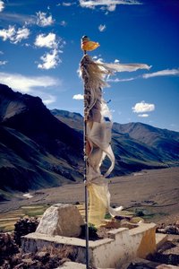 Prayer flag above the monastery (Gompa) of Tanze, in the Kurgiakh valley. The wind is believed to propagate the prayers printed on tissue.
