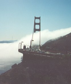 The Bridge in morning fog, viewed from the Marin County (northern) side.   is barely visible through the haze above the fog.
