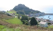 Mont Orgueil dominates the small harbour of Gorey and guards Jersey from attack from the French coast opposite