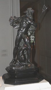  sculpture holding a trident