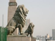 Lions guard the Kasr-el-Nil Bridge which traverses the Nile at Tahrir Square. European architecture and urban design, major infrastructural projects and intense cultural patronage were part of  Ismail's vision for Cairo as "Paris on the Nile." 