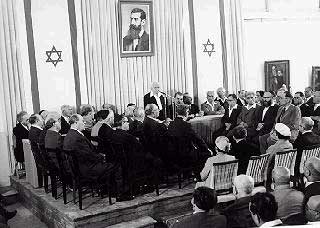  (First Prime Minister of Israel) publicly pronouncing the Declaration of the State of Israel, May 14, 1948. , , beneath a large portrait of , founder of modern political .