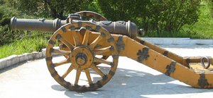 A small cast-iron cannon on a carriage
